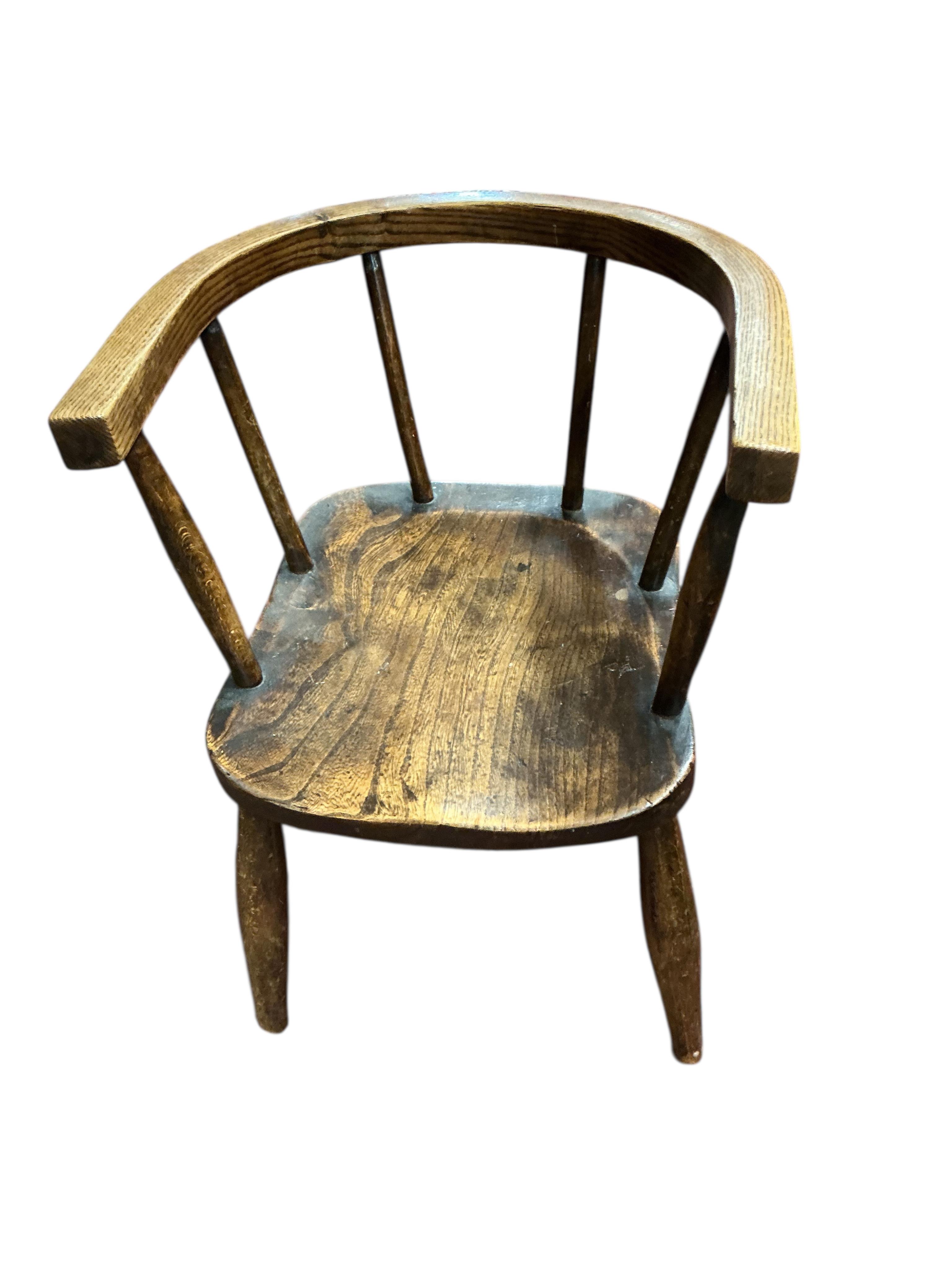 A Victorian mahogany child's rocking lambing commode chair, height 71cm and two later primitive style child’s chairs